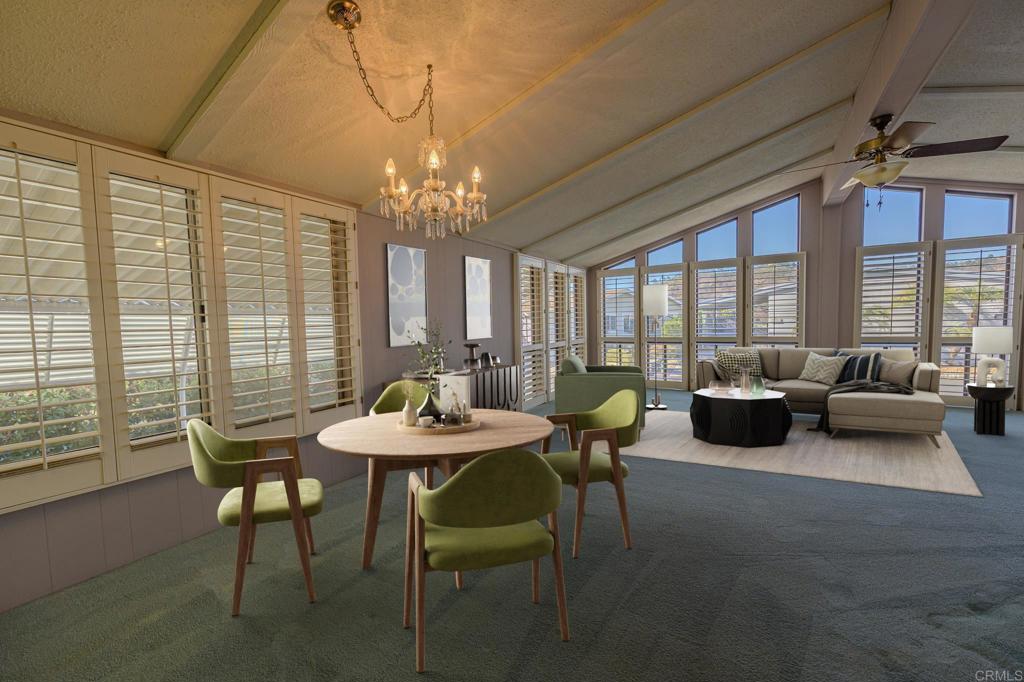 4650 Dulin Road, Unit 153 Fallbrook, CA 92003 - Photo 4 of 24 a view of a dining room with furniture a chandelier and large windows