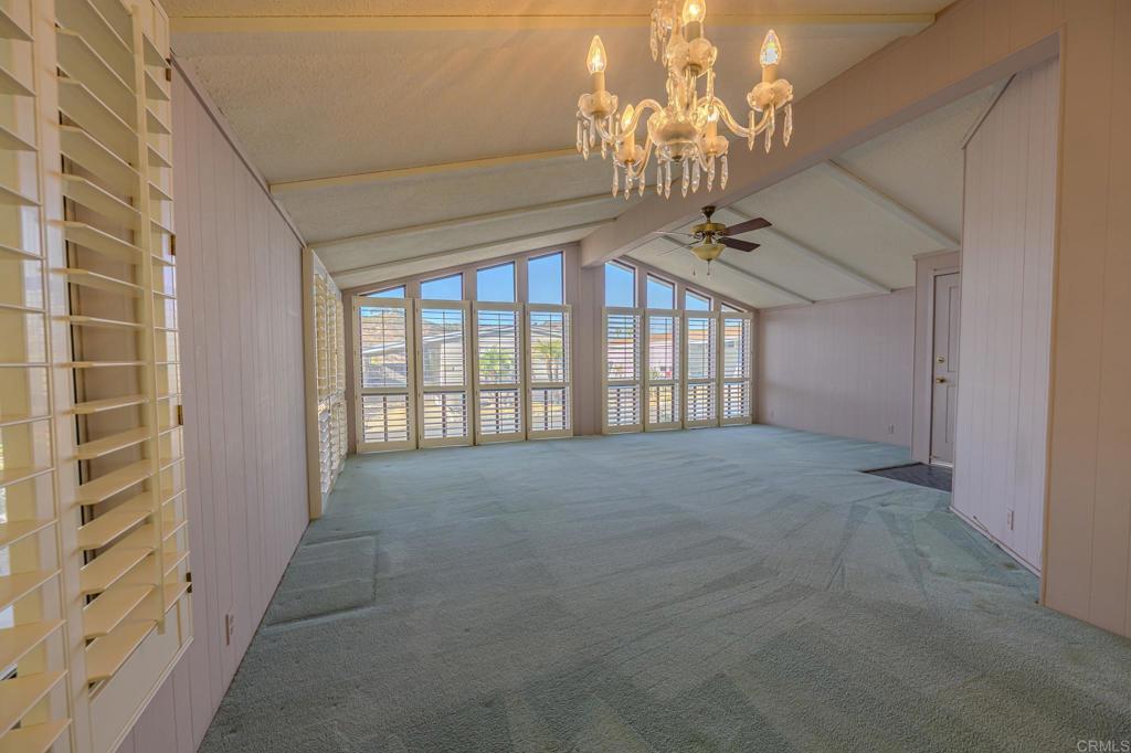 4650 Dulin Road, Unit 153 Fallbrook, CA 92003 - Photo 6 of 24 a view of an empty room with a chandelier
