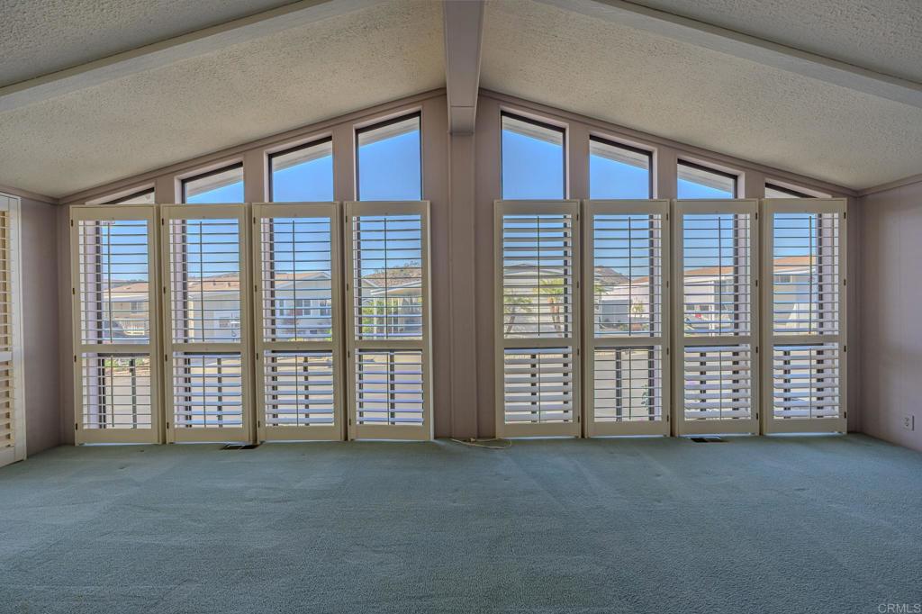 4650 Dulin Road, Unit 153 Fallbrook, CA 92003 - Photo 7 of 24 a view of an empty room with windows and view of room