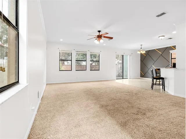 a view of kitchen with furniture and refrigerator