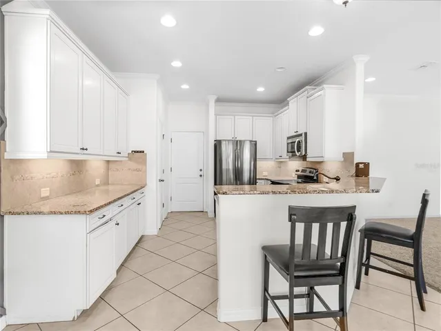 a white toilet sitting next to a shower