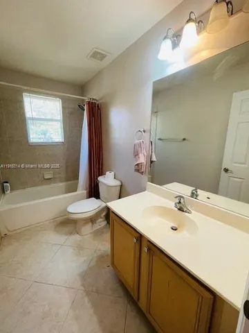 a bathroom with a sink double vanity and a bathtub