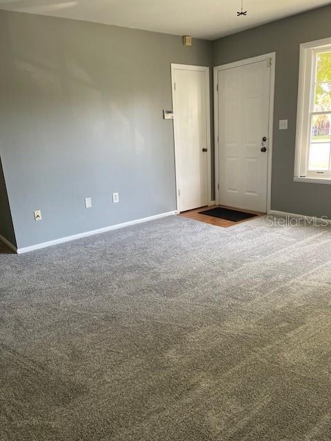 2501 Sheridan Road Mount Dora, FL 32757 - Photo 19 of 33 an empty room with windows and closet