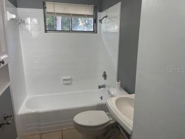a bathroom with a toilet and a bathtub