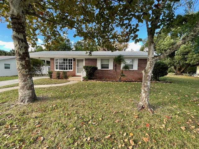 2501 Sheridan Road Mount Dora, FL 32757 - Photo 32 of 33 front view of a house with a yard