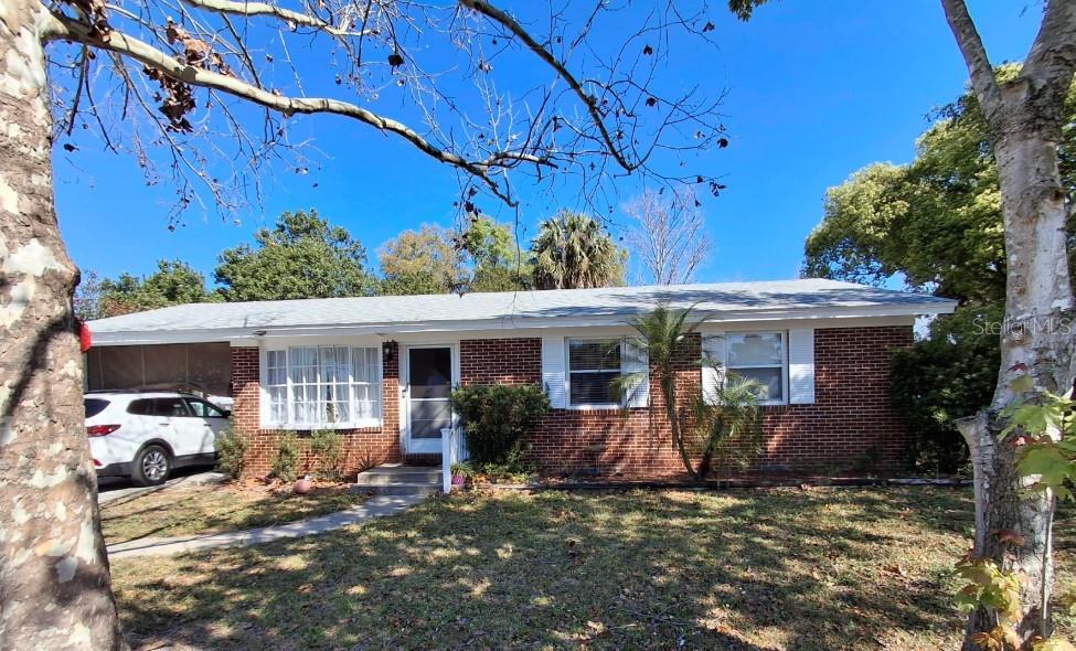 2501 Sheridan Road Mount Dora, FL 32757 - Photo 4 of 33 a view of a house with a patio