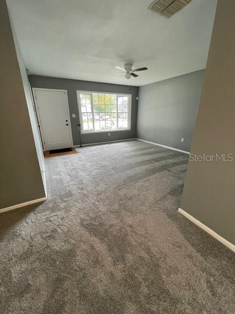 2501 Sheridan Road Mount Dora, FL 32757 - Photo 6 of 33 an empty room with windows