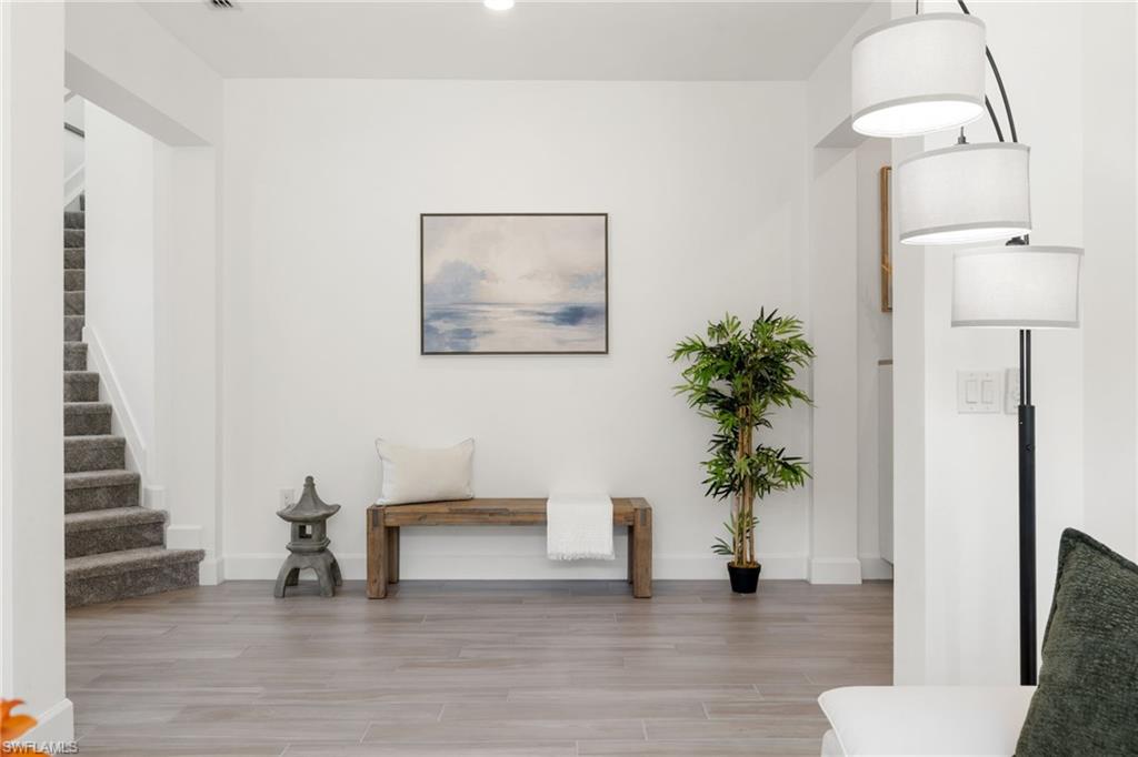 19824 Beverly Park Road Estero, FL 33928 - Photo 11 of 50 a view of an entryway with wooden floor