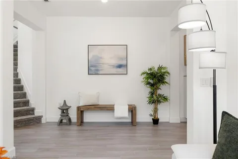 a view of an entryway with wooden floor