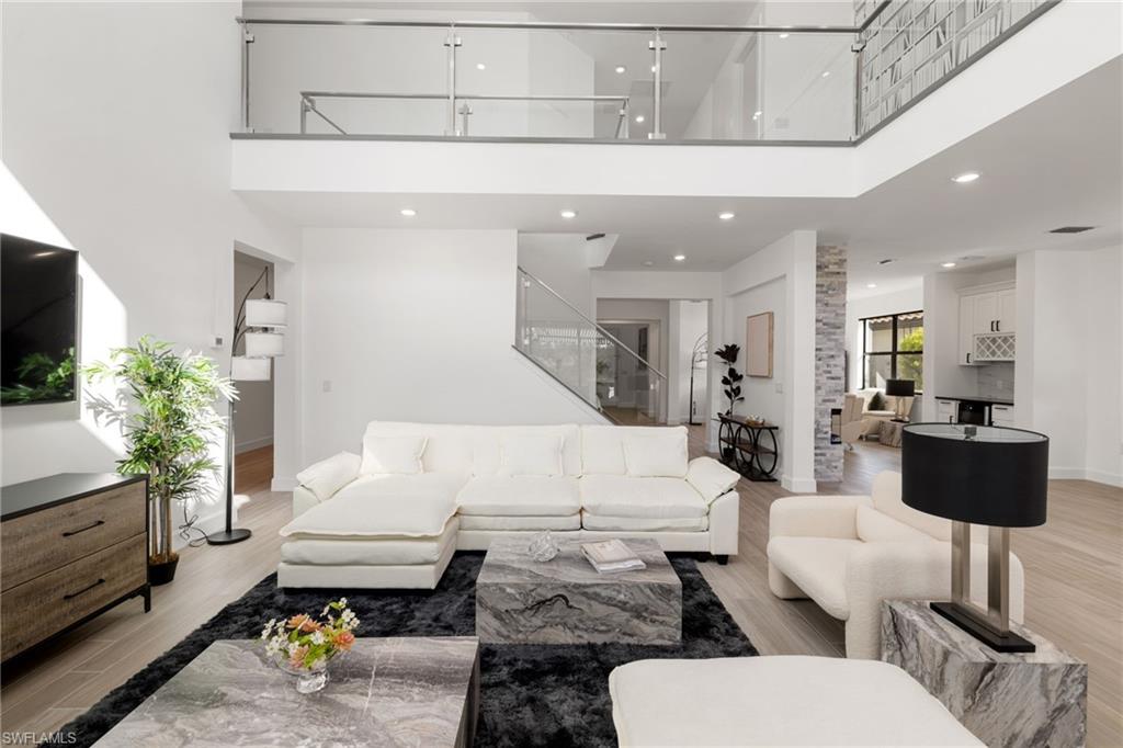 19824 Beverly Park Road Estero, FL 33928 - Photo 15 of 50 a living room with furniture and a flat screen tv