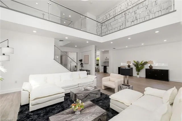 a kitchen with stainless steel appliances a refrigerator and a stove top oven