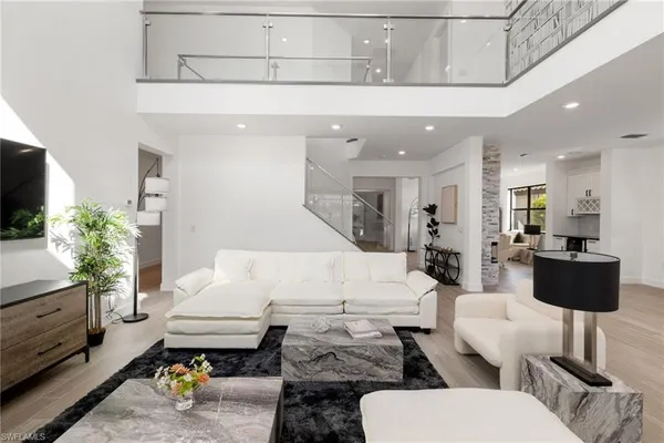 a kitchen with stainless steel appliances a refrigerator and a stove top oven