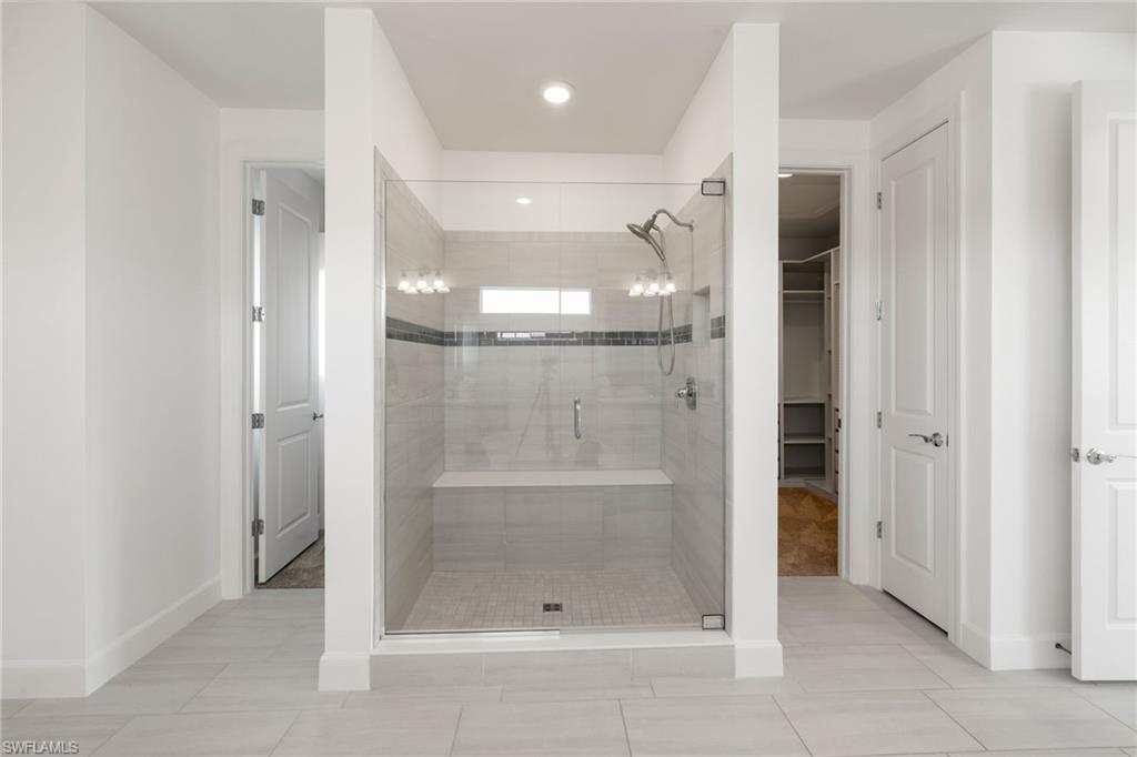19824 Beverly Park Road Estero, FL 33928 - Photo 26 of 50 a bathroom with a shower