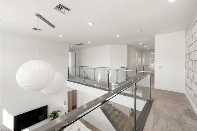 a view of staircase and kitchen with sink