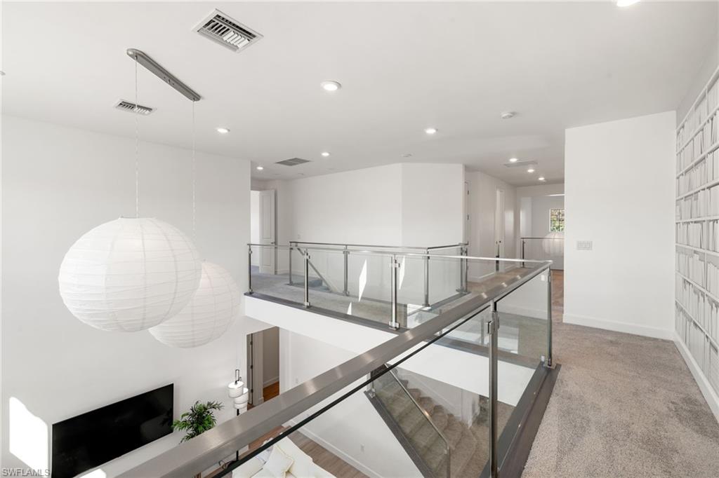 19824 Beverly Park Road Estero, FL 33928 - Photo 31 of 50 Staircase featuring recessed lighting and carpet flooring