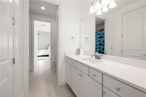 a en suite bathroom with a sink and a mirror