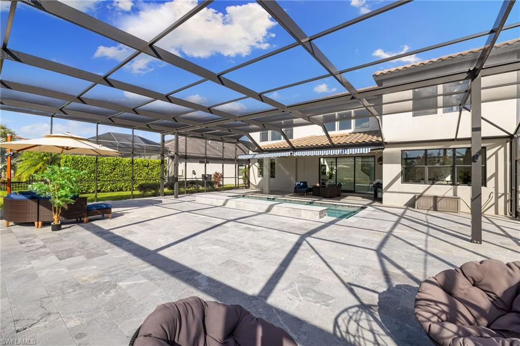 19824 Beverly Park Road Estero, FL 33928 - Photo 43 of 50 a view of a house with a patio