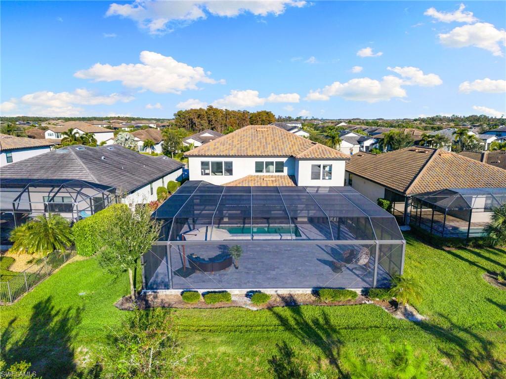 19824 Beverly Park Road Estero, FL 33928 - Photo 45 of 50 an aerial view of a house with a garden