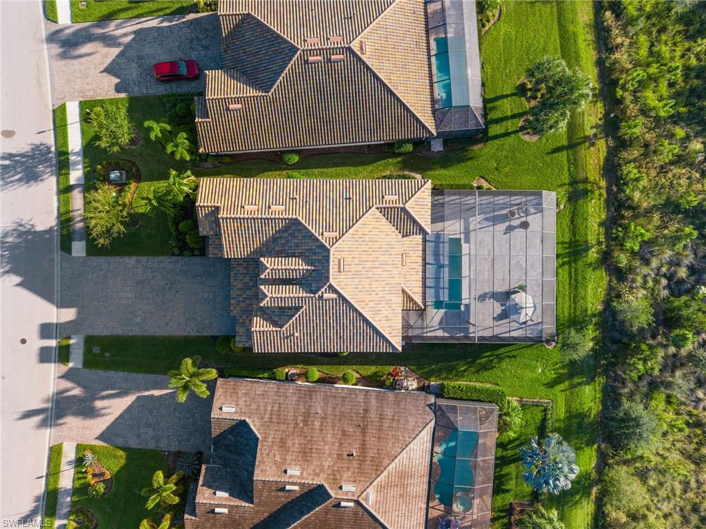 19824 Beverly Park Road Estero, FL 33928 - Photo 46 of 50 an aerial view of a house with a garden and plants