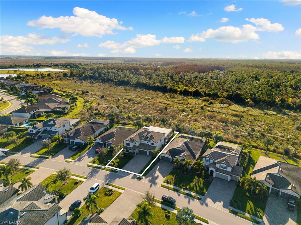 19824 Beverly Park Road Estero, FL 33928 - Photo 50 of 50 an aerial view of residential building with green space