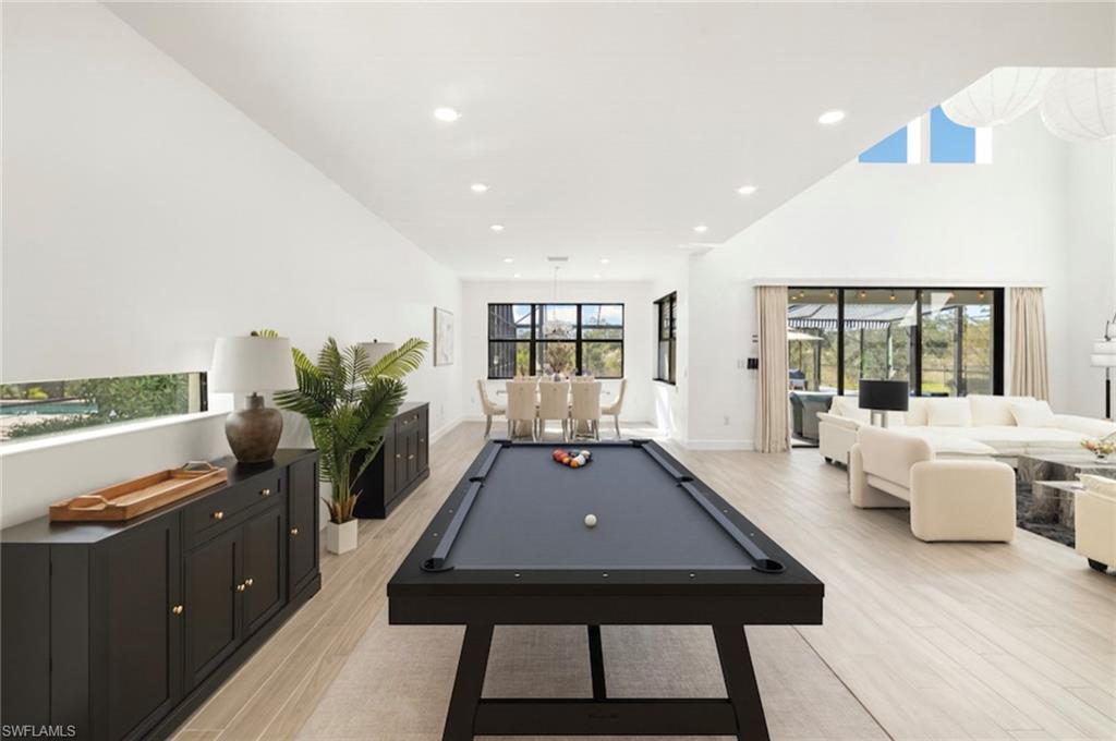 19824 Beverly Park Road Estero, FL 33928 - Photo 9 of 50 a room with furniture pool table and glass door