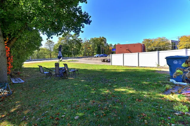 a view of a backyard with swimming pool