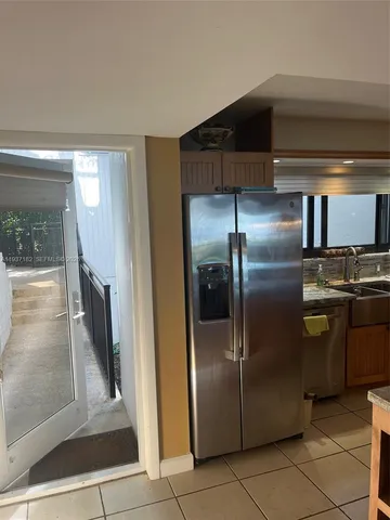 a living room with furniture and a walk in closet
