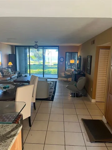 a bedroom with a bed and a night stand