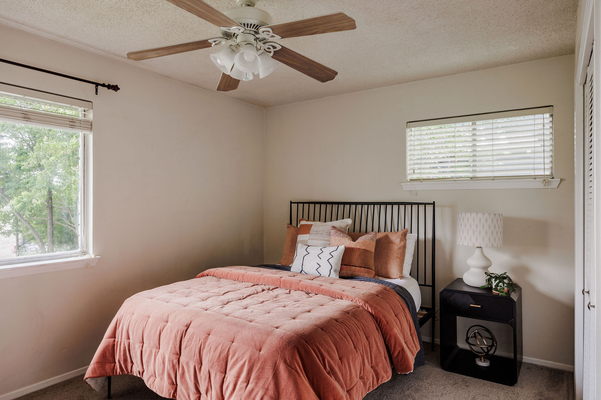 2012 Cody Court Austin, TX 78704 - Photo 15 of 40 Well-lit bedroom offers comfortable living, complete with a ceiling fan for climate control.