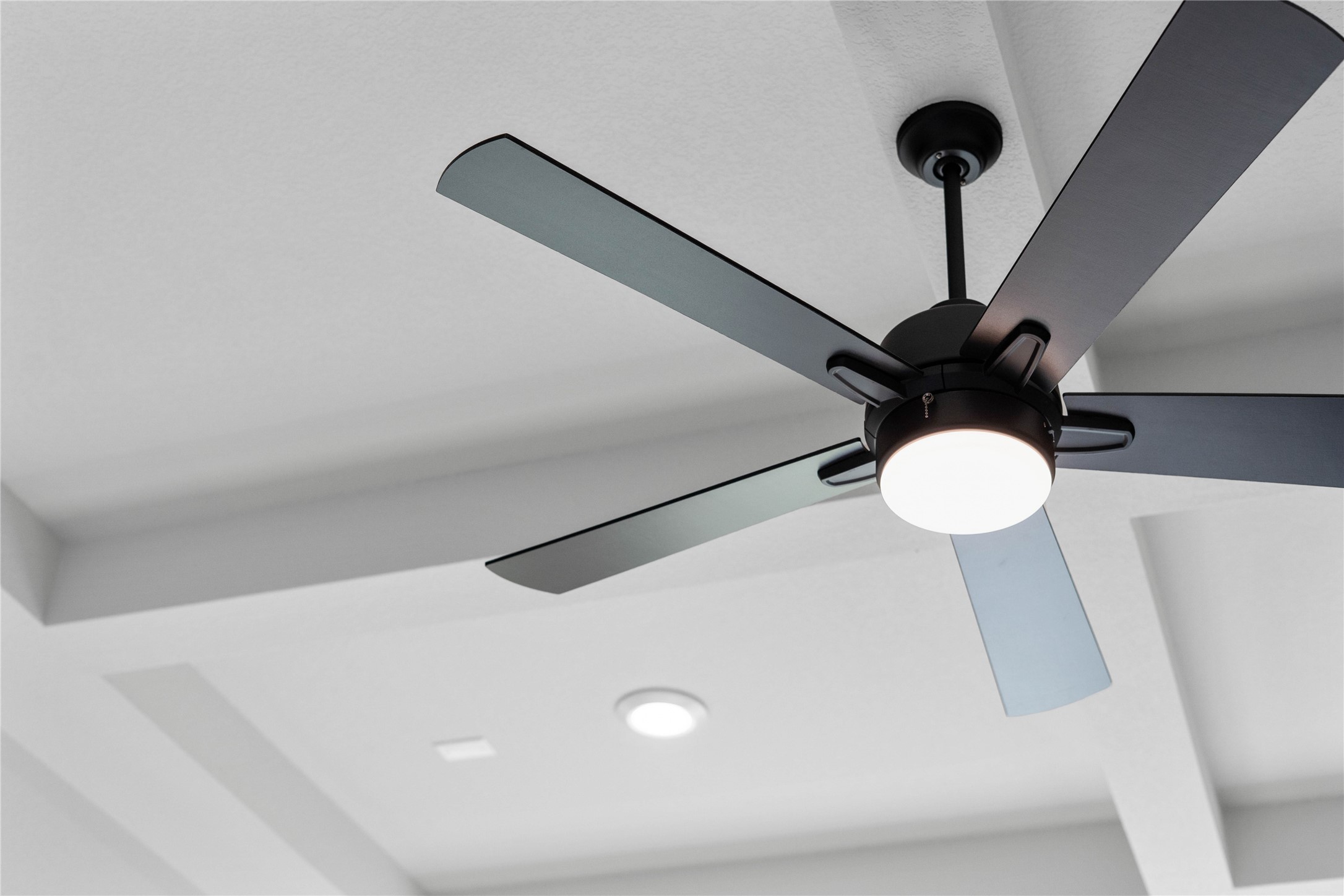 2114 Rowl Street Montgomery, TX 77316 - Photo 21 of 50 This sleek, modern ceiling fan adds both style and comfort to the room.