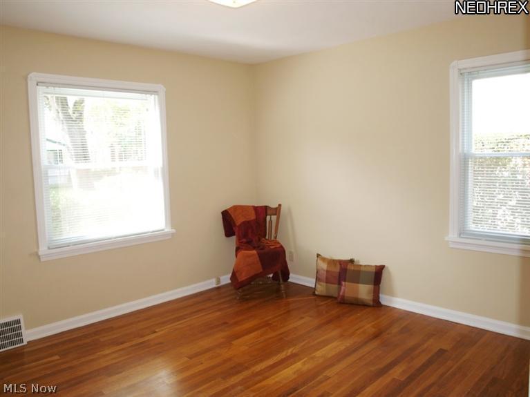 1577 Wood Road Cleveland, OH 44121 - Photo 8 of 25 1st floor bedroom with hardwood floor not laminate 12x11