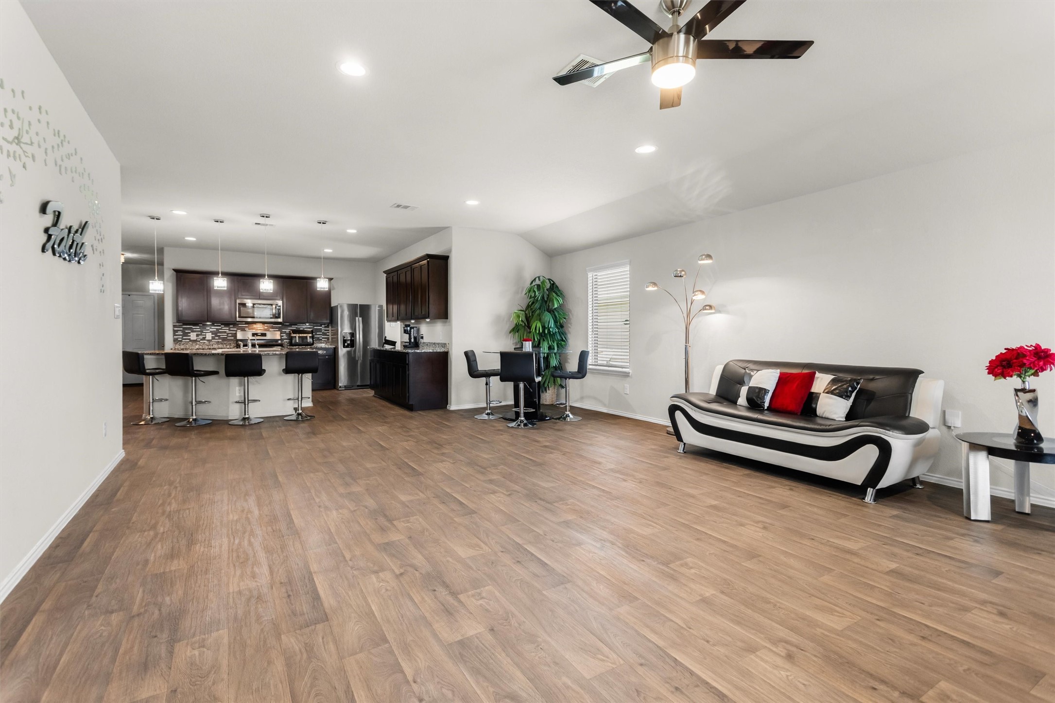 1711 Martin Spring Lane Rosenberg, TX 77469 - Photo 5 of 24 Living Room with an open flow into the Kitchen and Dining area.