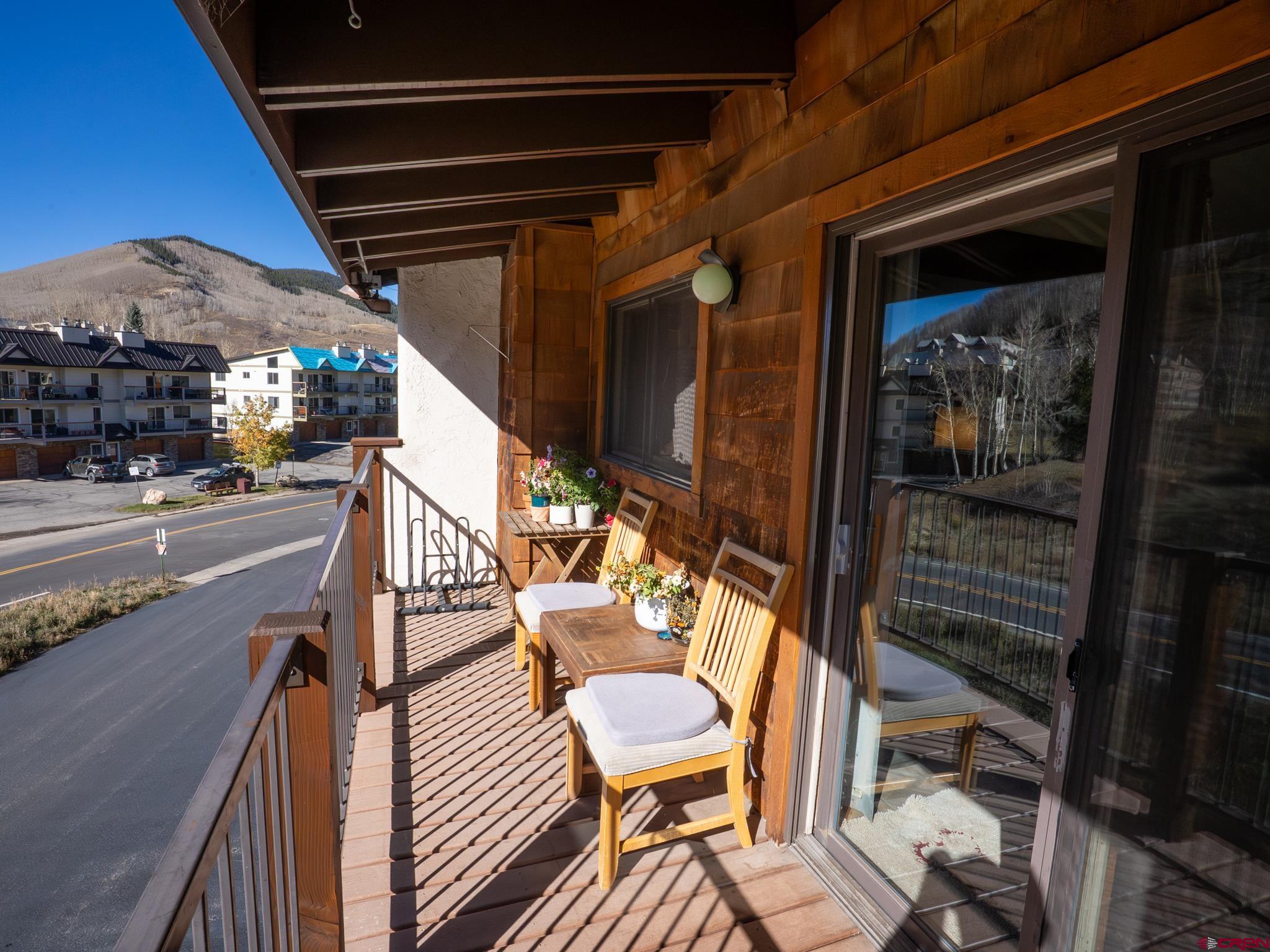 701 Gothic Road, Unit 338 Crested Butte, CO 81225 - Photo 28 of 42 a view of a porch with furniture and a potted plant
