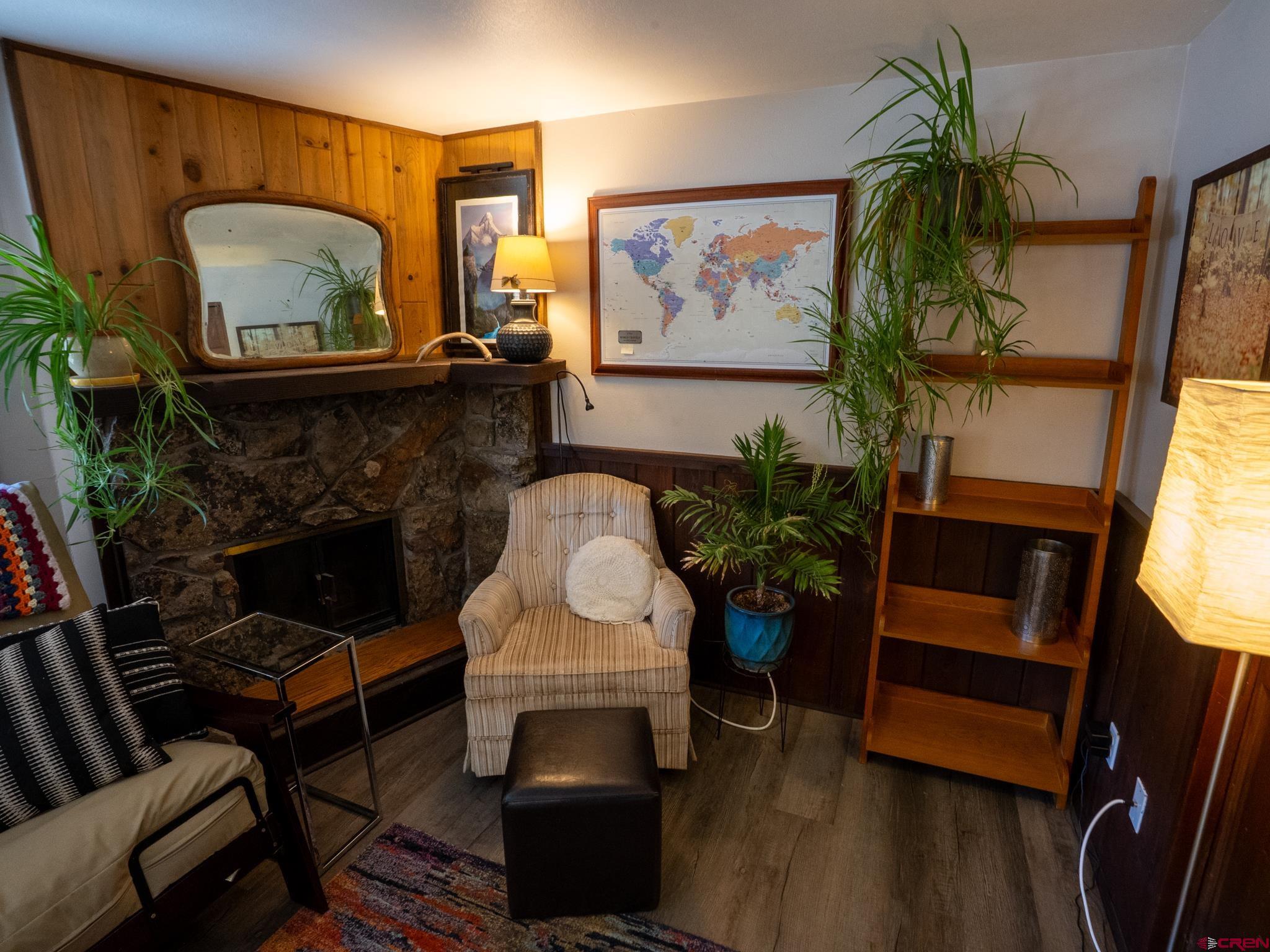 701 Gothic Road, Unit 338 Crested Butte, CO 81225 - Photo 4 of 42 a living room with furniture and a fireplace