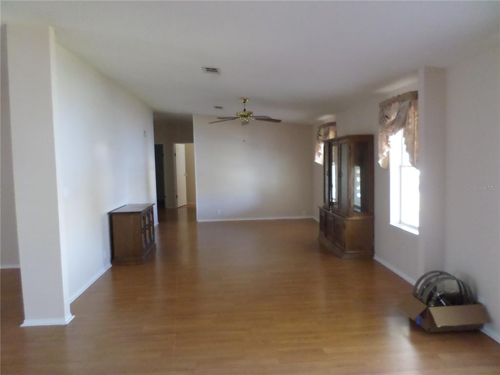 1690 Southwest 35th Circle Okeechobee, FL 34974 - Photo 12 of 23 a view of a livingroom with a staircase