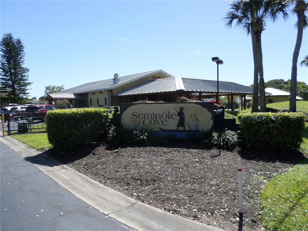 1690 Southwest 35th Circle Okeechobee, FL 34974 - Photo 3 of 23 a front view of a house with garden