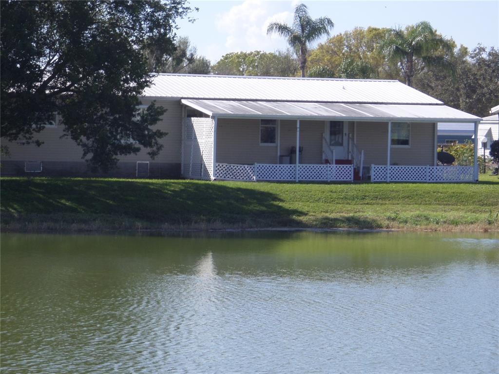 1690 Southwest 35th Circle Okeechobee, FL 34974 - Photo 8 of 23 a front view of a house with a yard