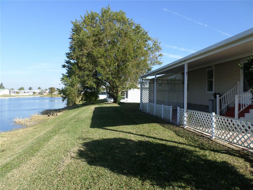 1690 Southwest 35th Circle Okeechobee, FL 34974 - Photo 9 of 23 a front view of a house with a yard