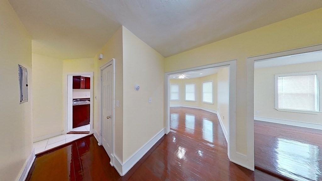 a view of an entryway with wooden floor