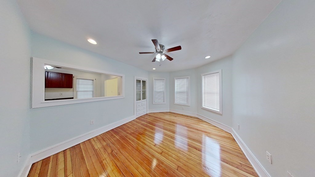 3 Dunlap Street Boston, MA 02124 - Photo 14 of 42 a very nice looking room with a ceiling fan