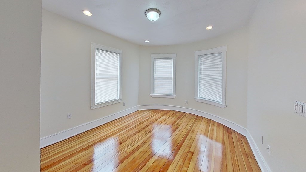 3 Dunlap Street Boston, MA 02124 - Photo 15 of 42 a view of room with window and wooden floor