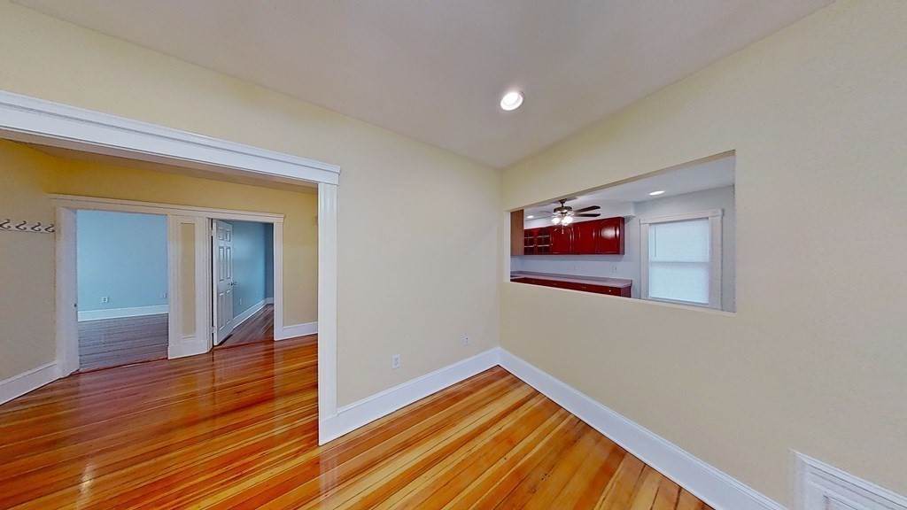 3 Dunlap Street Boston, MA 02124 - Photo 19 of 42 a view of a hallway with wooden floor