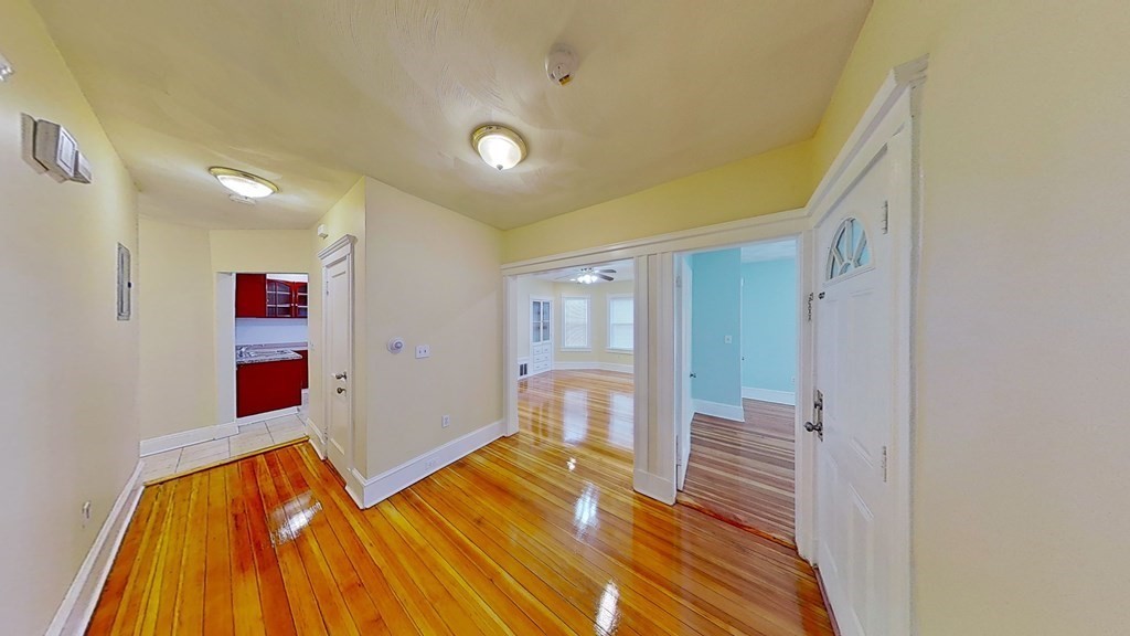 3 Dunlap Street Boston, MA 02124 - Photo 2 of 42 a bedroom with a bed and a view of bathroom