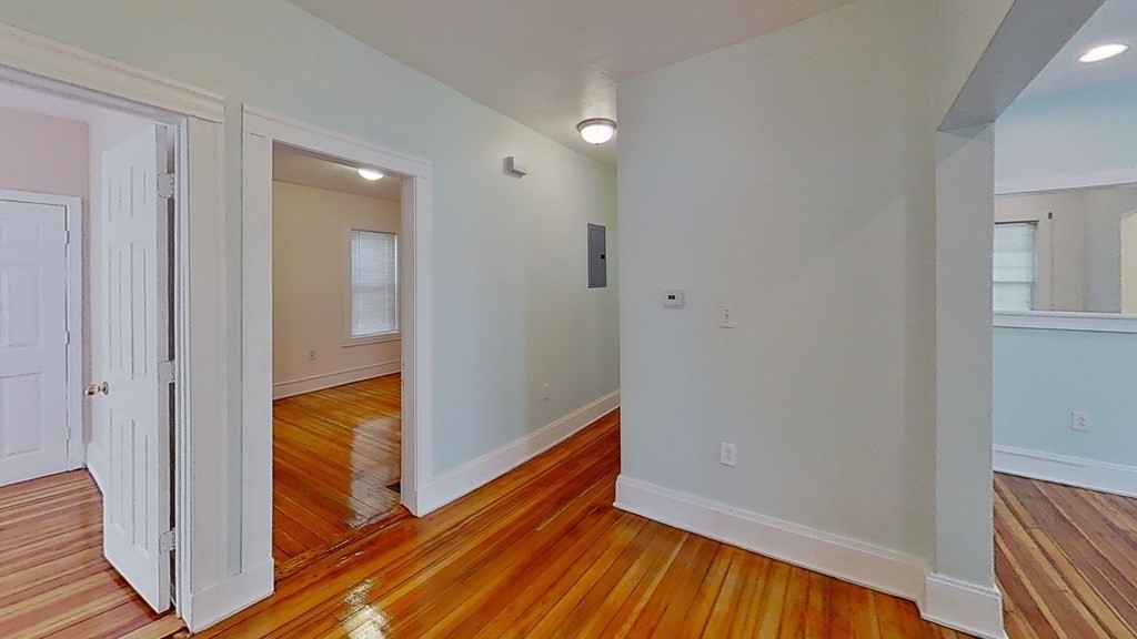 3 Dunlap Street Boston, MA 02124 - Photo 25 of 42 a view of hallway with wooden floor