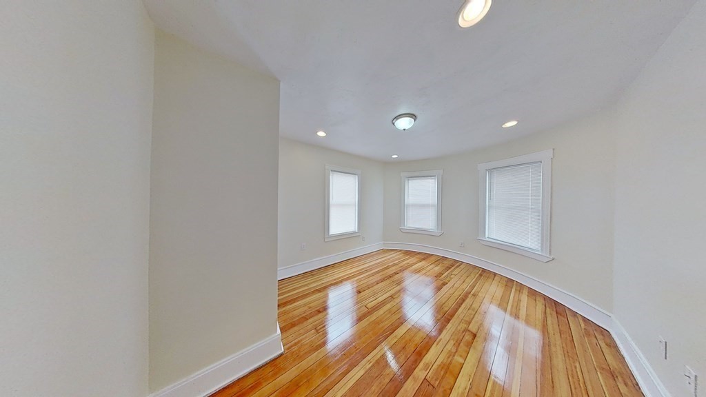 3 Dunlap Street Boston, MA 02124 - Photo 27 of 42 a view of empty room with wooden floor