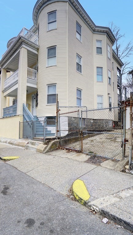 3 Dunlap Street Boston, MA 02124 - Photo 42 of 42 a bathroom with a granite countertop sink and a mirror