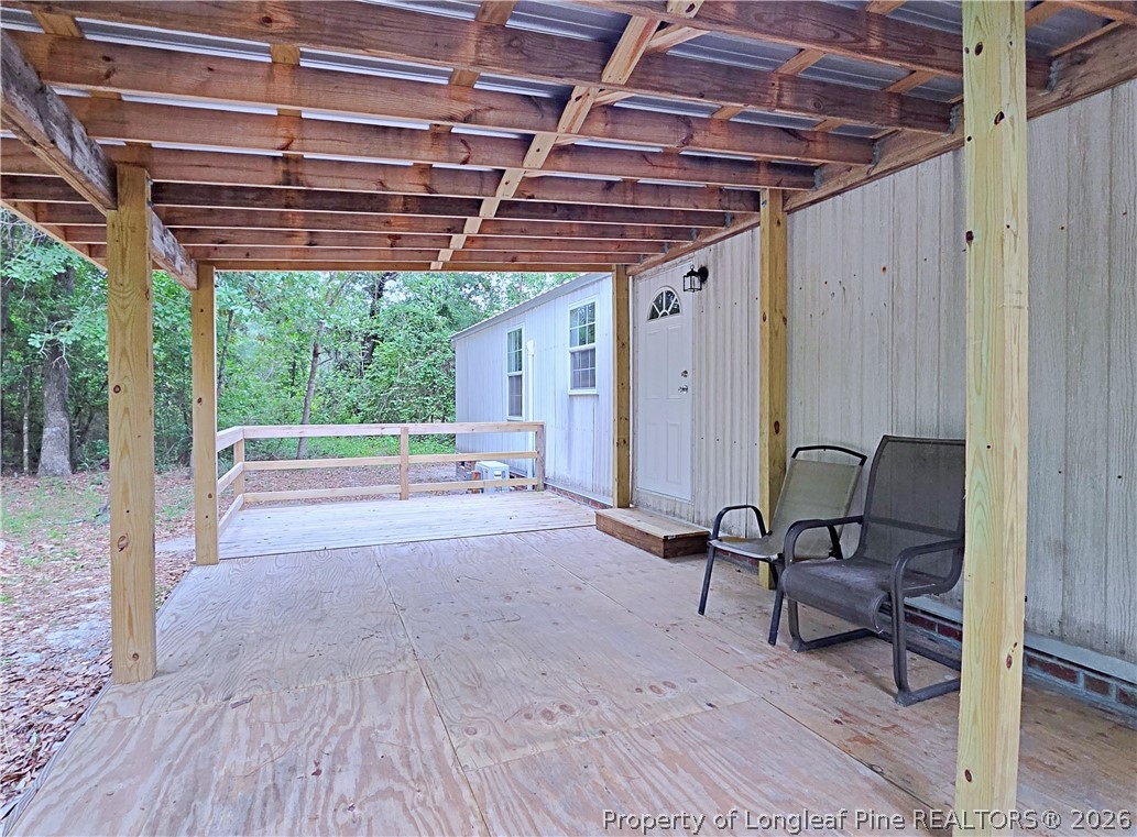 1031 Pine Acres Road White Oak, NC 28399 - Photo 26 of 29 a view of a room with wooden furniture and roof