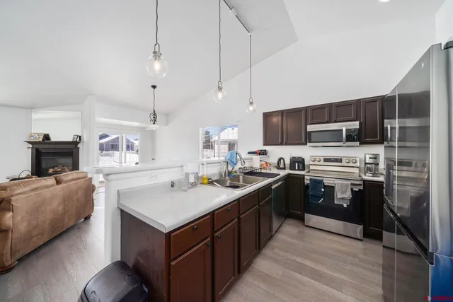 a kitchen with a sink stove and oven