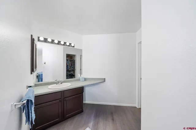 a bathroom with a double vanity sink and mirror