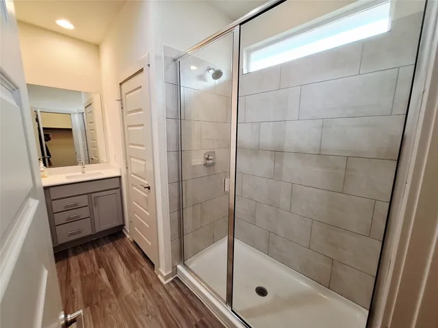 an empty room with windows and entrance